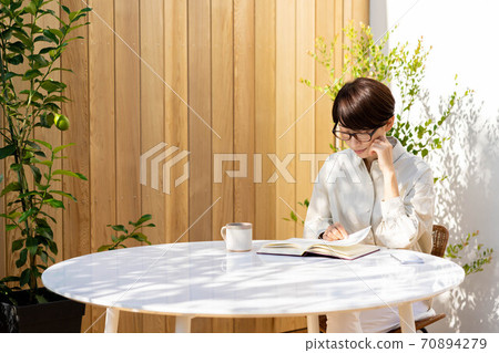 Women's terrace reading, relaxing lifestyle 70894279