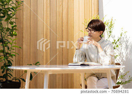 Women's terrace reading, relaxing lifestyle 70894281