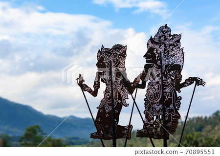 Black shadow silhouette of traditional Balinese puppets Wayang Kulit Black shadow silhouette of traditional Balinese puppets Wayang Kulit 70895551