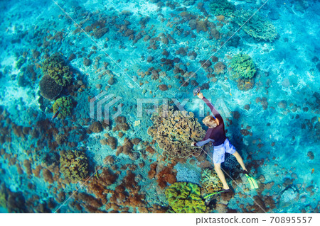 Young man in snorkelling mask dive underwater 70895557