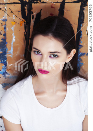 young brunette woman with fashion makeup on painted background, lifestyle people concept young brunette woman with fashion makeup on painted background, lifestyle people concept 70895766