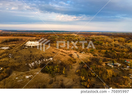 Distant view of chalk butte hill in autumn 70895997
