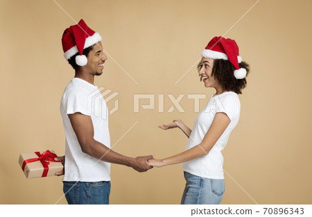 Gift-giving on New Year eve and romantic surprise 70896343