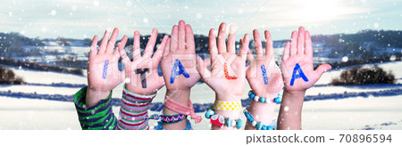 Children Hands Building Word Italia Means Italy, Snowy Winter Background Children Hands Building Word Italia Means Italy, Snowy Winter Background 70896594