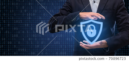 Closeup of businessman holding security shield hologram 70896723