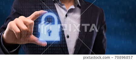 Closeup of businessman holding security padlock hologram Closeup of businessman holding security padlock hologram 70896857
