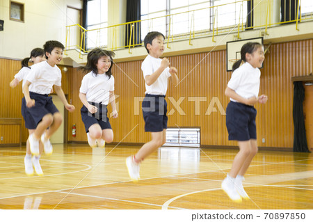 Elementary school student jumping rope 70897850