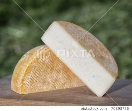 Craft cheese from cows and goats milk. Cheese head Craft cheese from cows and goats milk. Cheese head 70898726