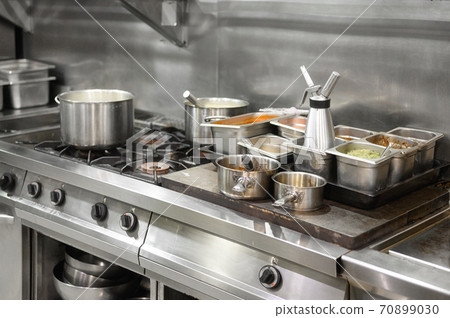 Stainless steel restaurant professional kitchen equipment and work surface. Stainless steel restaurant professional kitchen equipment and work surface. 70899030