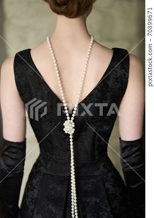 Female figure in a beautiful dress and beads Female figure in a beautiful dress and beads 70899671