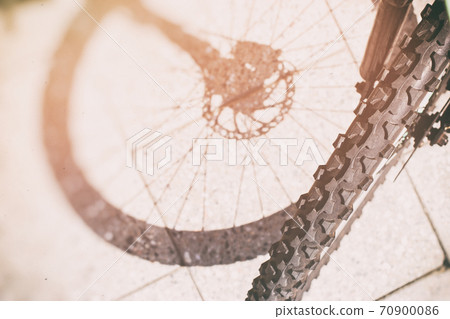 Bicycle wheel and tyre part grunge background Bicycle wheel and tyre part grunge background 70900086