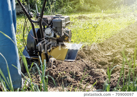 Outdoor garden spring plow job with motor cultivator Outdoor garden spring plow job with motor cultivator 70900097
