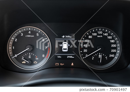 MURES, ROMANIA - OCTOBER 21, 2020, interior view of brand new Hyundai Tucson 2020. Close up of instrument panel with odometer, speedometer and fuel level. MURES, ROMANIA - OCTOBER 21, 2020, interior view of brand new Hyundai Tucson 2020. Close up of instrument panel with odometer, speedometer and fuel level. 70901497