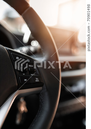 MURES, ROMANIA - OCTOBER 21, 2020, interior view of brand new Hyundai Tucson 2020. Leather covered wheel with audio control buttons. MURES, ROMANIA - OCTOBER 21, 2020, interior view of brand new Hyundai Tucson 2020. Leather covered wheel with audio control buttons. 70901498