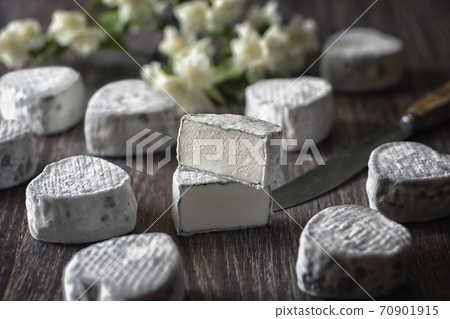 Craft cheese from cows and goats milk. Cheese head Craft cheese from cows and goats milk. Cheese head 70901915