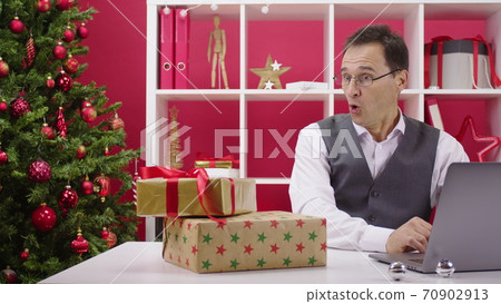 online Gifts fall on table at Christmas decorated office after enter pushing online Gifts fall on table at Christmas decorated office after enter pushing 70902913