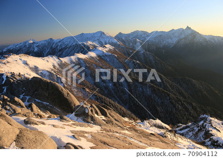From Mt. Tsubakuro in the Northern Alps, the surface of the first snowfall that shines in the setting sun Ginza course, Yarihodaka mountain range, Mt. From Mt. Tsubakuro in the Northern Alps, the surface of the first snowfall that shines in the setting sun Ginza course, Yarihodaka mountain range, Mt. 70904112