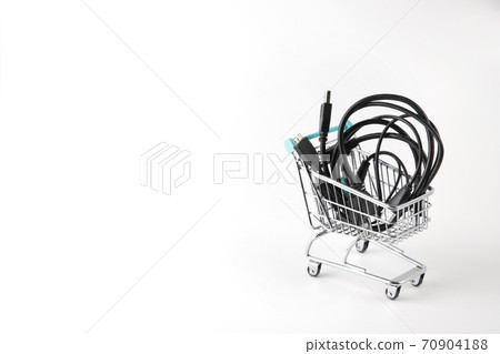 miniature shopping cart with wires on white background 70904188