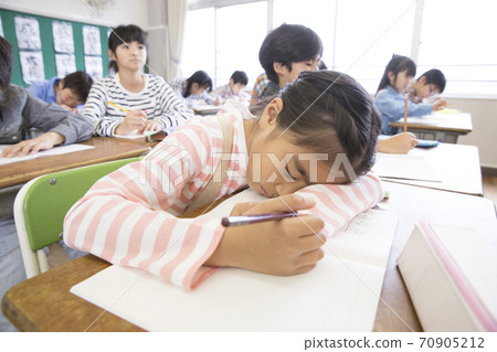Girl taking a nap 70905212