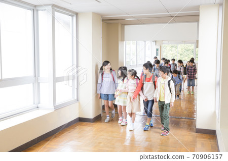 Elementary school students walking in the hallway Elementary school students walking in the hallway 70906157