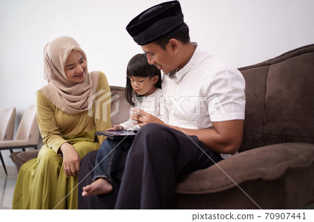 family working remotely from home sitting together family working remotely from home sitting together 70907441