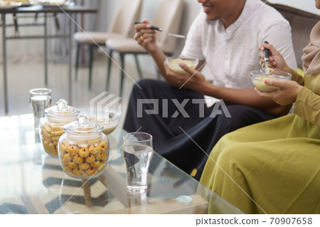 muslim couple having some food for breaking the fast 70907658