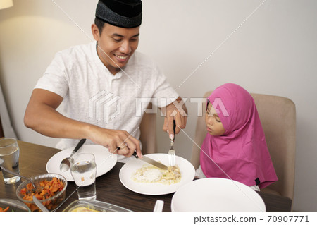 muslim family dinner break fasting together muslim family dinner break fasting together 70907771