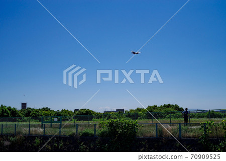 Landing plane and landscape of blue sky Landing plane and landscape of blue sky 70909525