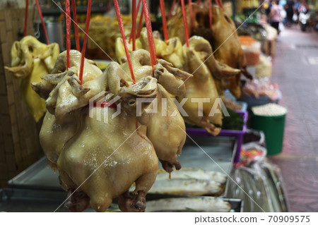 Boiled chicken hanging with red rope , Meats cooked in Chinatown market , Thailand 70909575