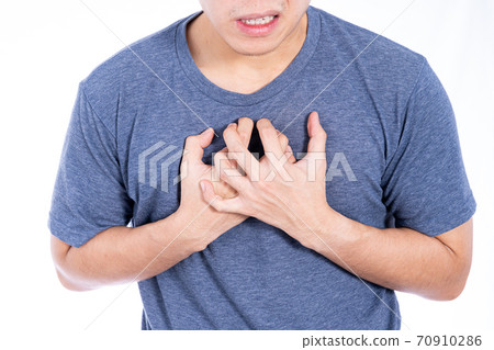 Man touching his heart or chest isolated white background. Healthcare medical or daily life concept. Man touching his heart or chest isolated white background. Healthcare medical or daily life concept. 70910286