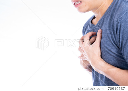 Man touching his heart or chest isolated white background. Healthcare medical or daily life concept. Man touching his heart or chest isolated white background. Healthcare medical or daily life concept. 70910287