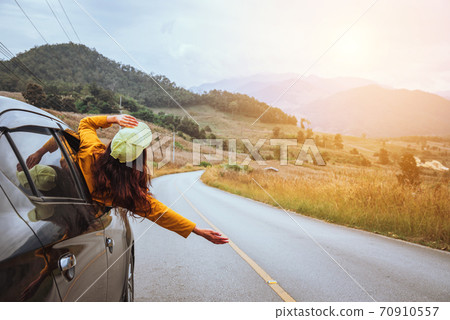 Asian women travel relax in the holiday. driving a car traveling happily 70910557
