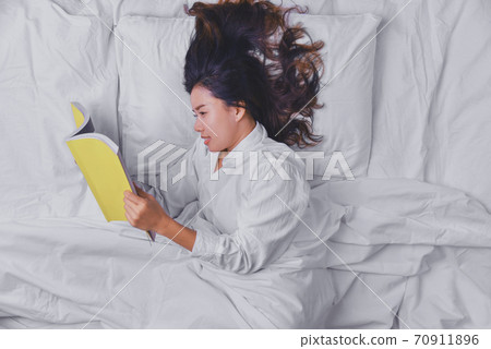 Young Woman Sleeping In Bed. 70911896