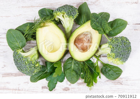 Green fruit and vegetables as source vitamins and minerals, healthy nutrition concept Green fruit and vegetables as source vitamins and minerals, healthy nutrition concept 70911912