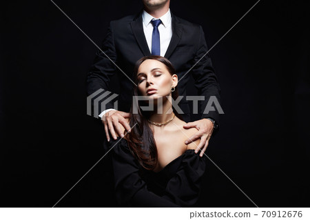 elegant girl seducing her handsome boyfriend elegant girl seducing her handsome boyfriend 70912676