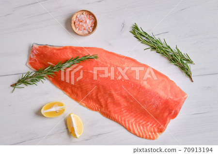 Raw frozen salmon fillet Raw frozen salmon fillet 70913194