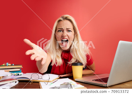 disappointed caucasian woman is dazed and confused by a mistake in official documents disappointed caucasian woman is dazed and confused by a mistake in official documents 70913372
