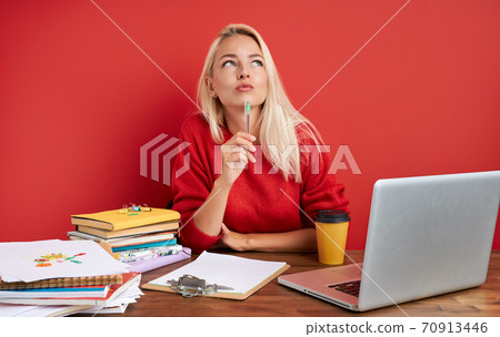 young secretary is bored at work place 70913446