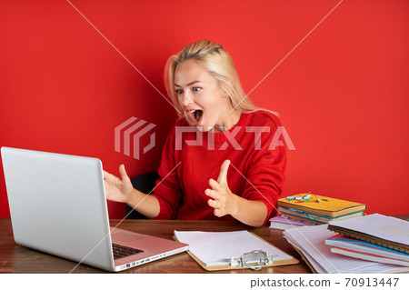 happy caucasian woman look at screen of laptop at work 70913447