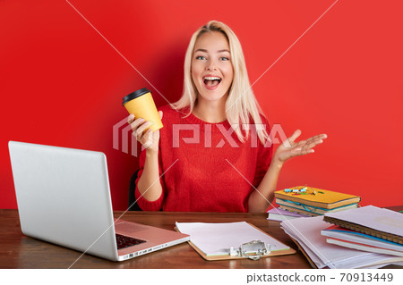 portrait of cheerful blonde lady having fun at work place isolated portrait of cheerful blonde lady having fun at work place isolated 70913449