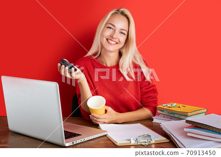 portrait of cheerful blonde lady having fun at work place isolated portrait of cheerful blonde lady having fun at work place isolated 70913450