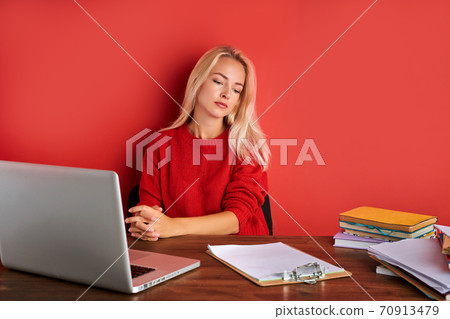 portrait of young caucasian blonde female at work place portrait of young caucasian blonde female at work place 70913479