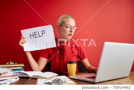 young stressed female working with computer laptop in frustration, depression 70914992