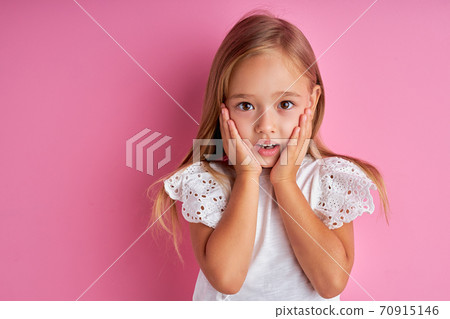 surprised girl emotionally reacts on something 70915146