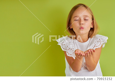 wonderful little child girl send a kiss at camera wonderful little child girl send a kiss at camera 70915152