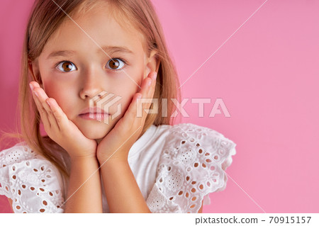 surprised girl emotionally reacts on something 70915157