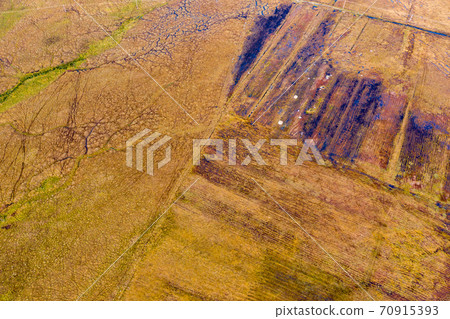 Aerial view of peat cutting aerial is Donegal - Ireland Aerial view of peat cutting aerial is Donegal - Ireland 70915393
