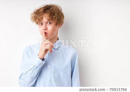 handsome caucasian boy has a secret handsome caucasian boy has a secret 70915766