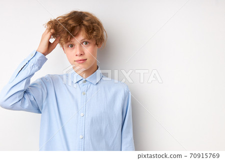 serious caucasian boy is in contemplation serious caucasian boy is in contemplation 70915769