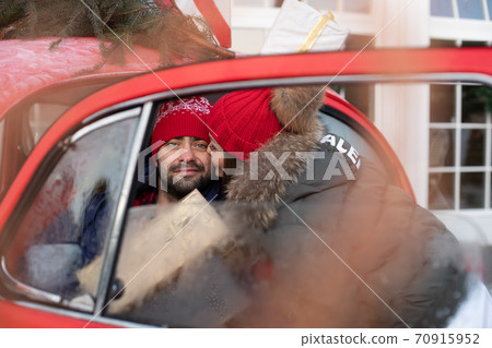 Young lovely couple buys Christmas presents for Young lovely couple buys Christmas presents for 70915952